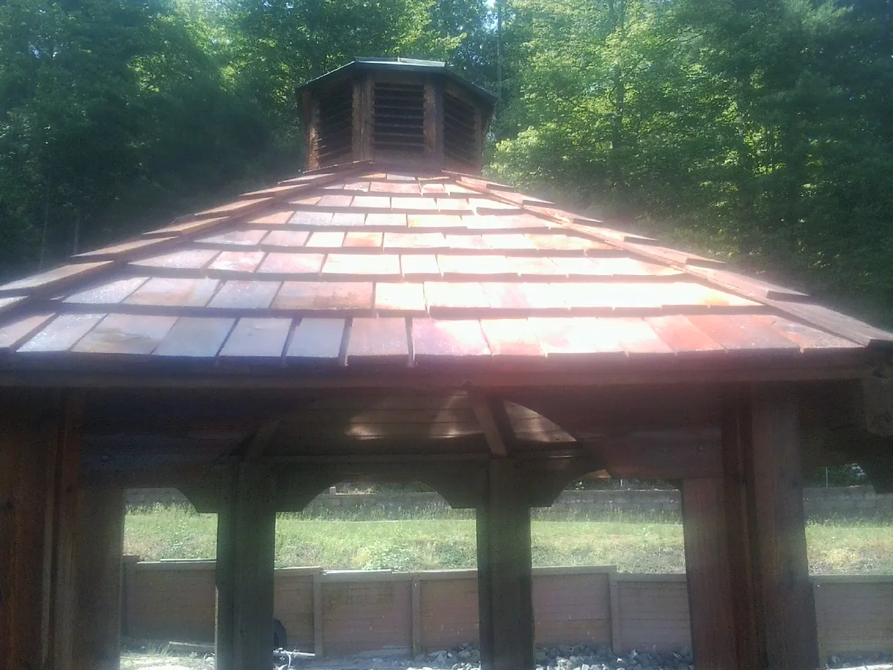 New cedar shake roof and cupola on a lakeside gazebo in Eagle Grove